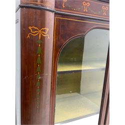 Edwardian mahogany display cabinet, shaped front with painted ribbon and bellflower garland decoration, enclosed by two glazed doors, cabriole supports