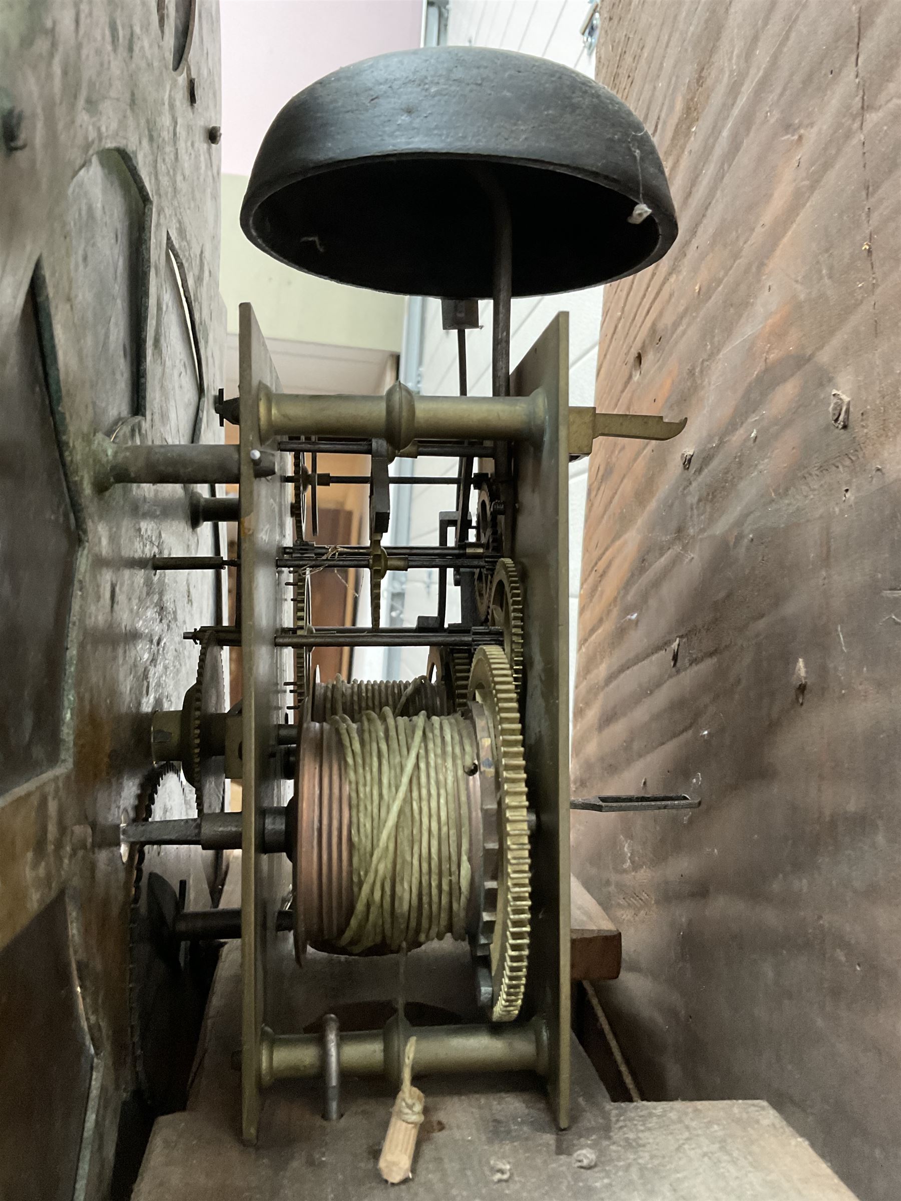 Edward Golland of Retford (Notts) - mid-18th century 8-day carved oak longcase c1760 , with a stepped caddy top and blind fret, break arch hood door flanked by carved pilasters with brass capitals,  trunk with a carved break arch toped door on a carved plinth with applied skirting and feet, brass dial with matching steel hands, silvered and engraved dial centre and chapter ring, with seconds dial and calendar aperture, four seasons spandrels and boss to the arch with makers name, four pillar rack striking movement, striking the hours on a bell. With weights and pendulum.            
Edward Golland is recorded as working in Retford during the late 18th century.