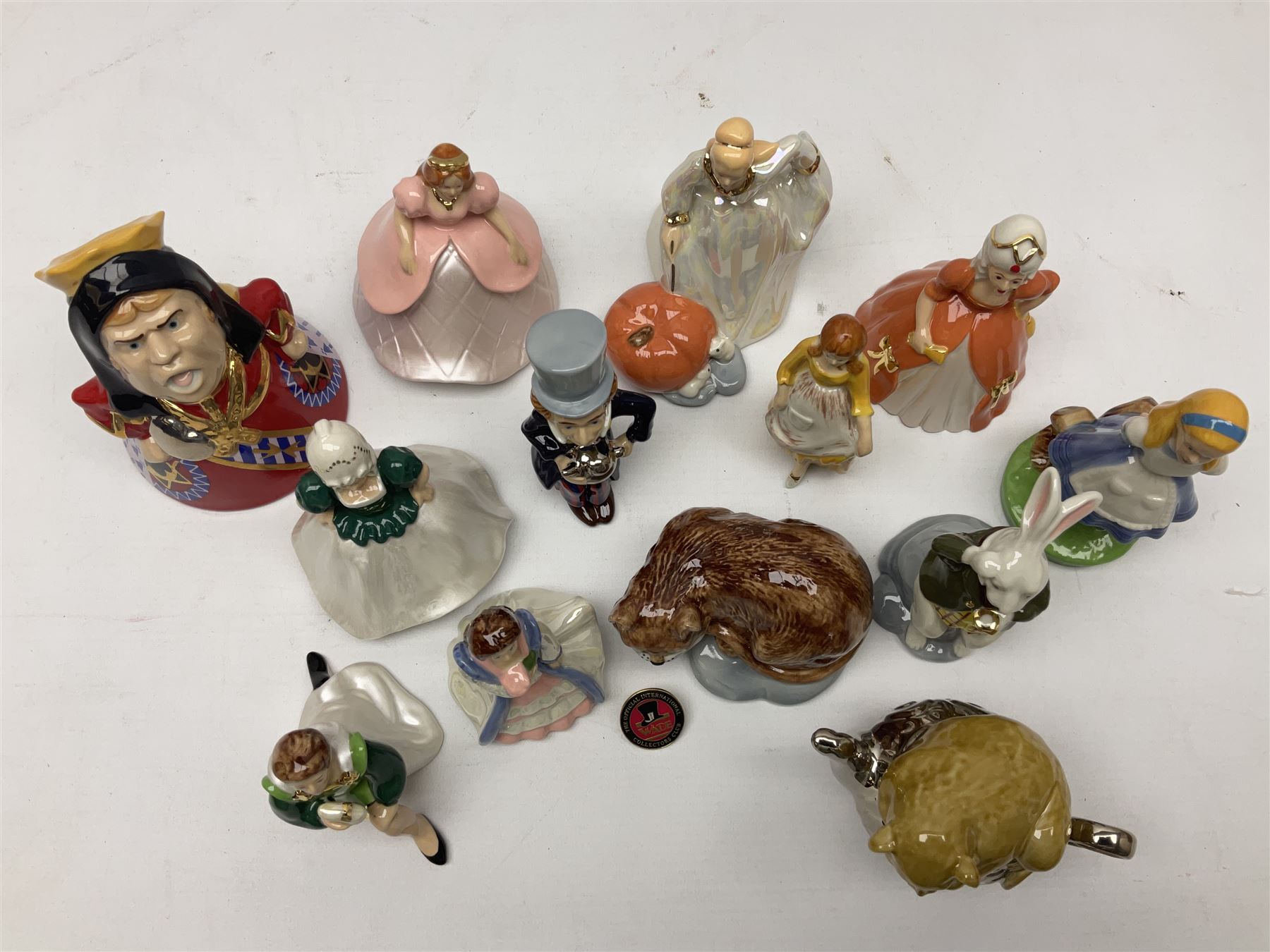 Thirteen Wade Collectors Club figures, comprising six Alice in Wonderland figures; Queen of Hearts, Alice, Mad Hatter, The Doormouse, White Rabbit and Cheshire cat, six Cinderella figures; Fairy Godmother, Cinderella Ready for the Ball, Prince Charming, Cinderella, Clorinda and Thisbe, together with Beauty from Beauty and the Beast, all with original boxes  