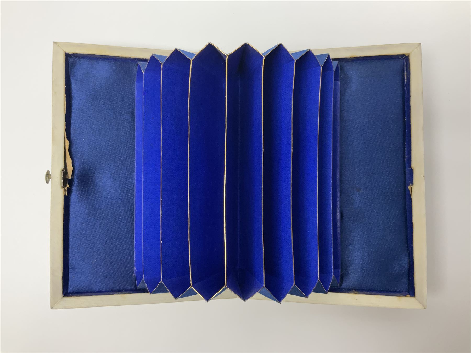 Victorian mother of pearl tea caddy, of rectangular bow-fronted form, the body with floral, bird and geometric engraved mother of pearl panels, white metal shield plaque to the cover inscribed with the initials G.J.A and similar escutcheon, the two division interior with ivory edging and two panelled mother of pearl lids, on four vegetable ivory bun feet L20cm, together with a similar style mother of pearl card case (2) This item has been registered for sale under Section 10 of the APHA Ivory Act