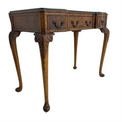 Early 20th century Queen Anne design walnut reverse break-front console side table, edge carved with acanthus decoration, fitted with three cock-beaded drawers, raised on cabriole supports with applied carved scrolling foliate decoration