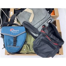 Large quantity of camera equipment in three boxes - Lumix GX1 camera, Canon EOS 500 camera, Lumix FZ100 camera, Pantax  MZ5n, various other cameras, Swift spotting Scope 20 x 60 in box,  Maxtor hard drive, three tripods, Kodak carousel projector, Pradolux slide projector, a selection of camera bags and other camera equipment. 