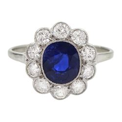 Palladium and platinum milgrain set oval sapphire and diamond cluster ring, sapphire approx 1.35 carat, total diamond weight approx 0.55 carat