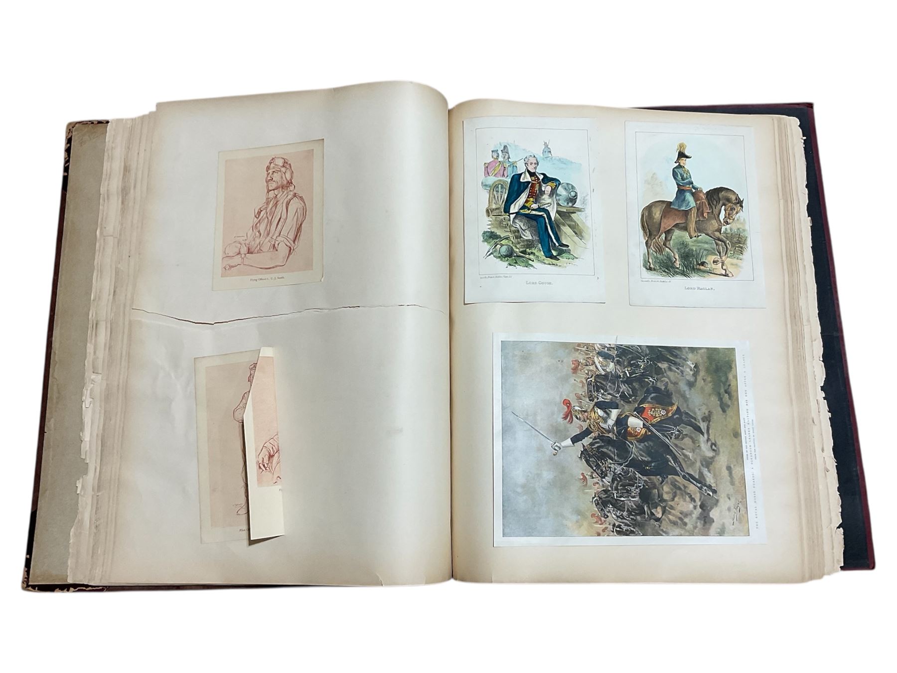 Large album of 19th century and later engravings and prints, mostly military, stuck down, album 49cm x 62cm overall