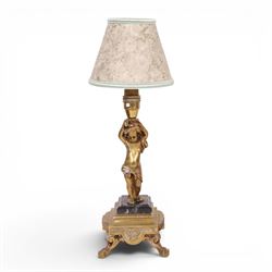 Pair of brass table lamps, the central column modeled as a putti upon a square marble base raised upon four claw feet, H29cm