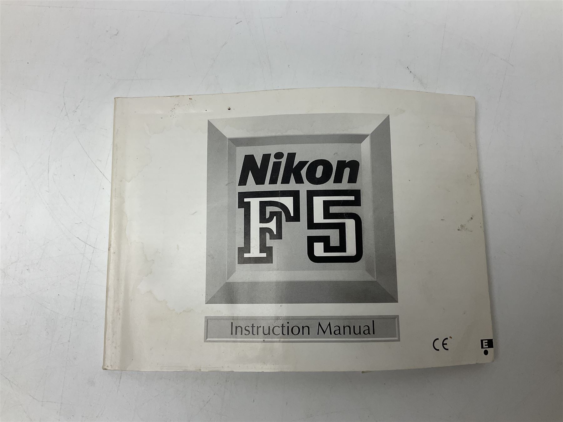 Nikon F3T camera body, in champagne/ titanium colourway, serial no. T8215031, with 'Nikon Nikkor 50mm 1:1.4' lens, Nikon MD4 motor drive, serial no. 156592 and Nikon MK-1 Firing range converter, all with original boxes 