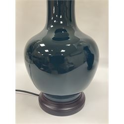 Pair of Chinese teal glazed table lamps, each of bottle form, raised upon circular hardwood bases, including shade H72cm 