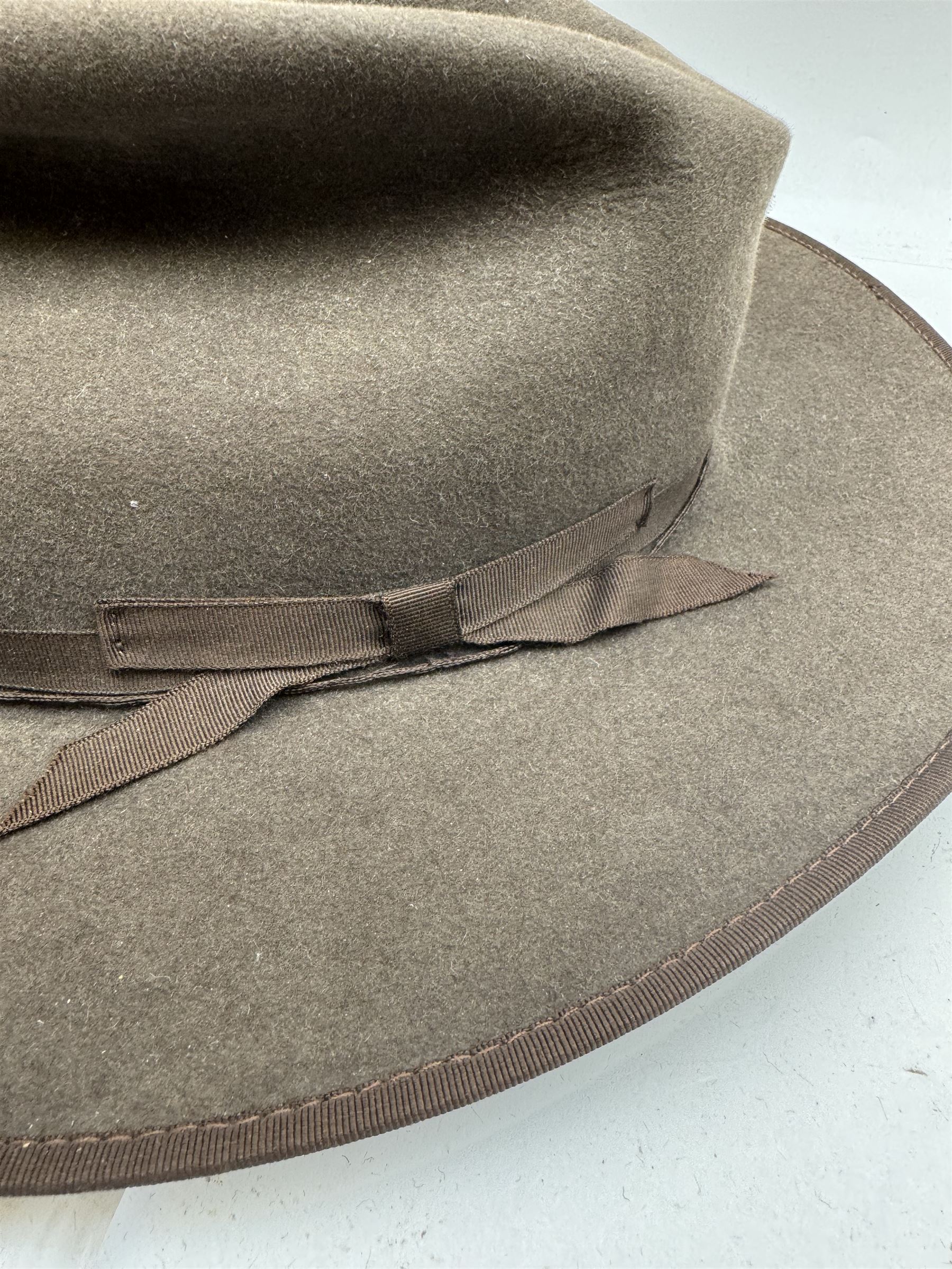 Akubra pure fur felt trilby hat, together with another trilby and two top hats, one by Woodrow and one by Dunn & Co