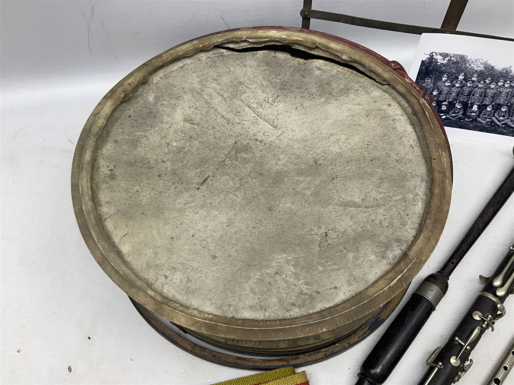 Disassembled early 20th century Boys Brigade snare drum D37cm with copy WW1 period photograph of the Kirbymoorside Boys Brigade; early 20th century hardwood clarinet; bagpipes chanter; and Dulcet E-flat penny whistle