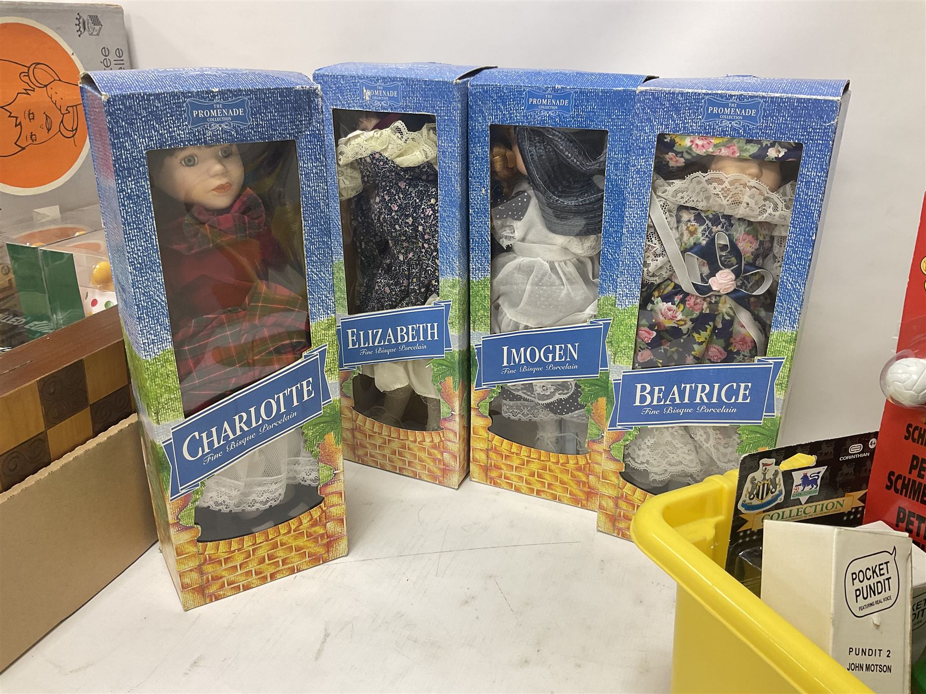 Collection of vintage and later toys and memorabilia to include Merlin’s Football sticker book, boxed child’s electric telephones, Only Fools and Horses money box, four boxed The Promenade Collection dolls etc in two boxes