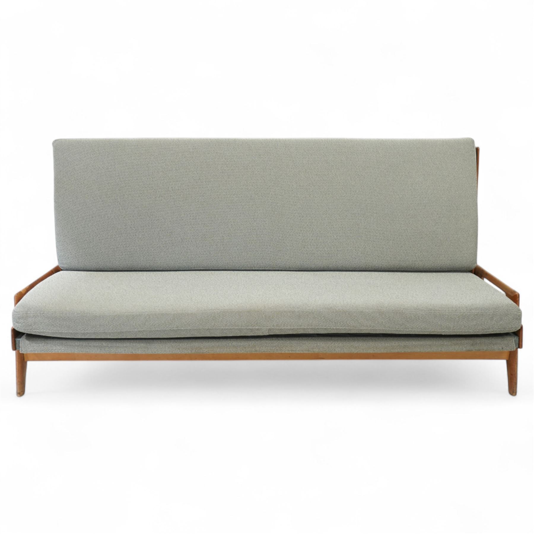 Gerard Guermonprez for Bobois - mid-century light teak sofa daybed, sides with angular teak wire sprung frame, integrated armrests with cut-out hand-holds, single fabric cushion back and seat, on out-swept tapered legs, circa 1955