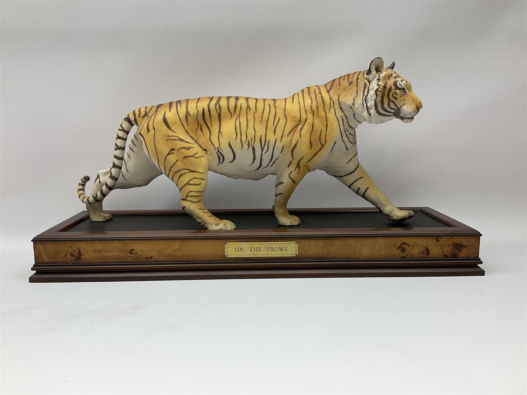 Three Franklin Mint figures, first example On The Prowl, on wooden stand H32cm, L63.5cm, Grizzly, H23cm and American Majesty by Ronald Van Ruyckevelt H37cm, together with five other figures.  