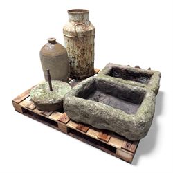 Two 19th century stone troughs, with mill stone, flagon and metal milk churn 