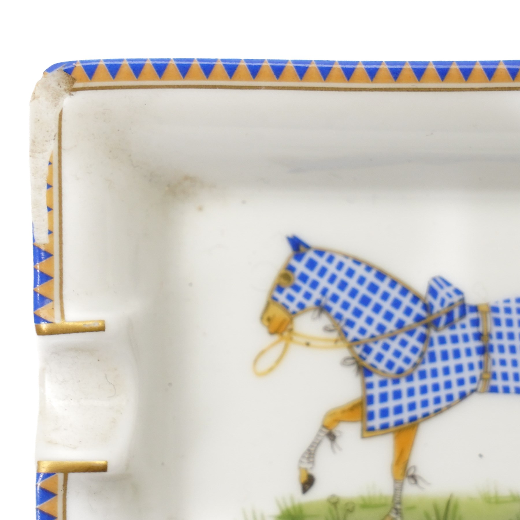Hermès - set of four miniature porcelain ashtrays, each decorated with a horse in differing blanket, with gilt and coloured borders, in contrasting colour with various horse-coats, in original fitted box