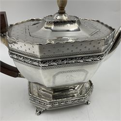 Victorian silver four piece tea service, comprising teapot, teapot stand, twin handled open sucrier and milk jug, each of octagonal form with foliate bud border and engraved decoration including crest to canted panels, and vacant panels, the teapot with ivory finial to the hinged cover and later wooden handle, hallmarked Edward Barnard & Sons Ltd, London1896, teapot including finial H15cm, milk jug including handle H16cm, teapot stand W11.5cm

This item has been registered for sale under Section 10 of the APHA Ivory Act