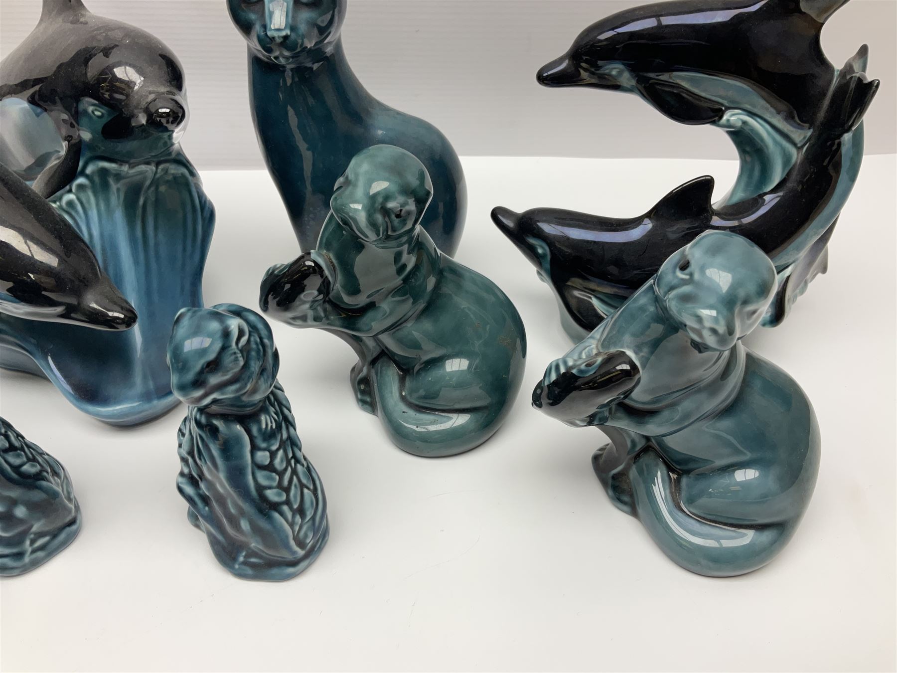 Collection of Poole pottery animals, including frogs, owls, otters, dolphins, mice etc, all with printed mark beneath (23)