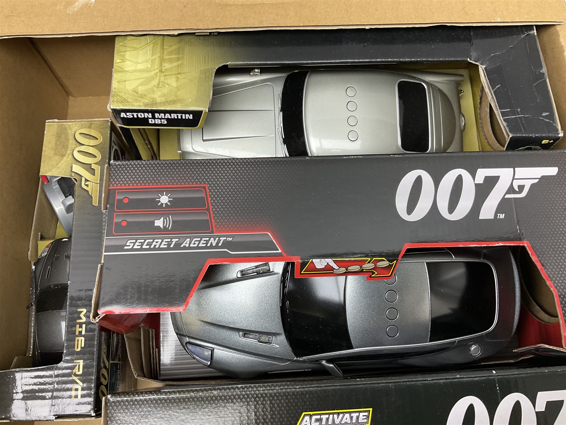 Two Toy State 007 large scale radio controlled cars - Aston Martin DB5 and Aston Martin DBS; eight other Toy State 007 James Bond vehicles; and ten other James Bond vehicles by Corgi and Fabbri; all boxed (20)