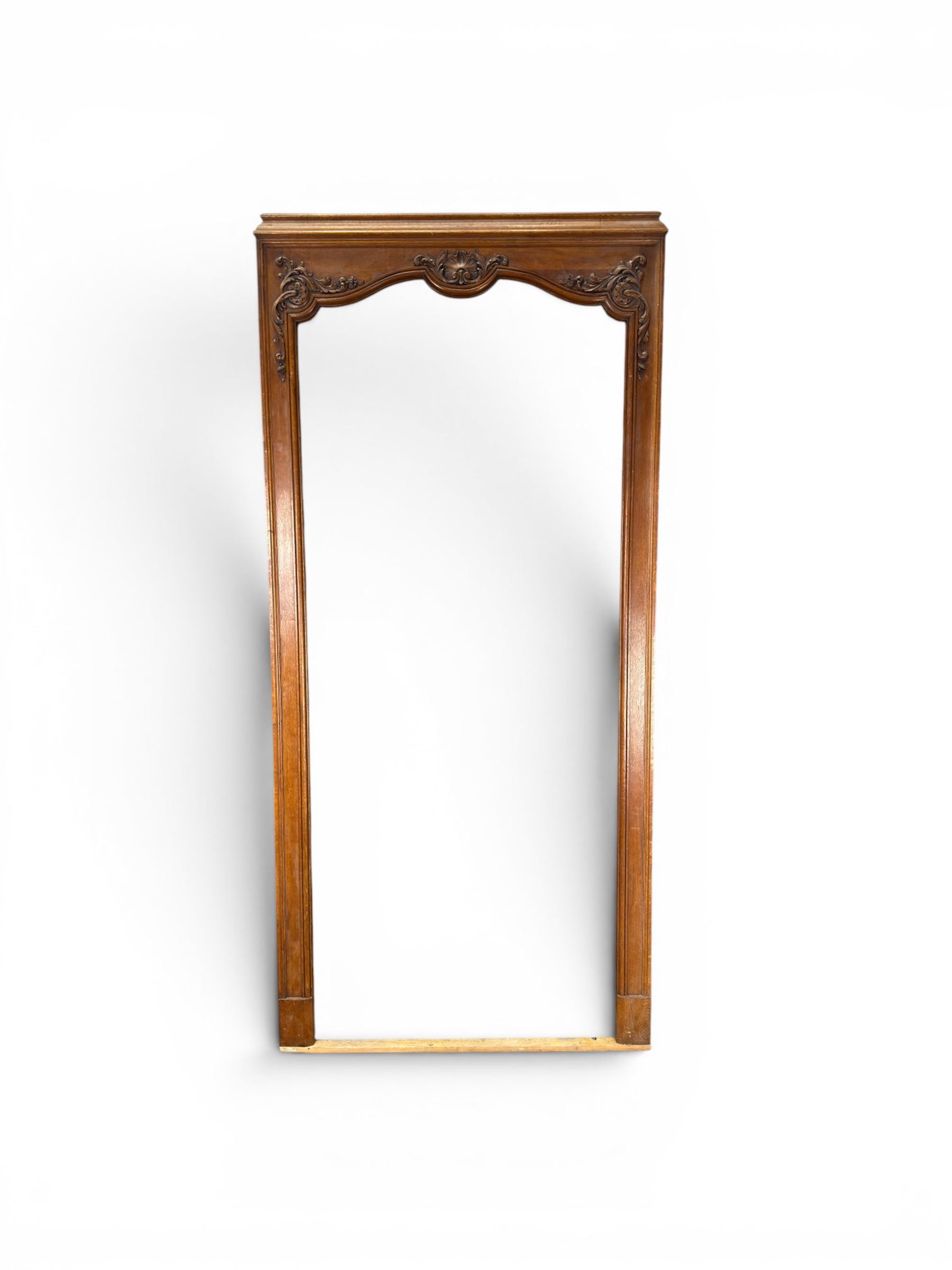 Early 20th century French oak window surround, shaped top with carved shell and acanthus leaf detail 