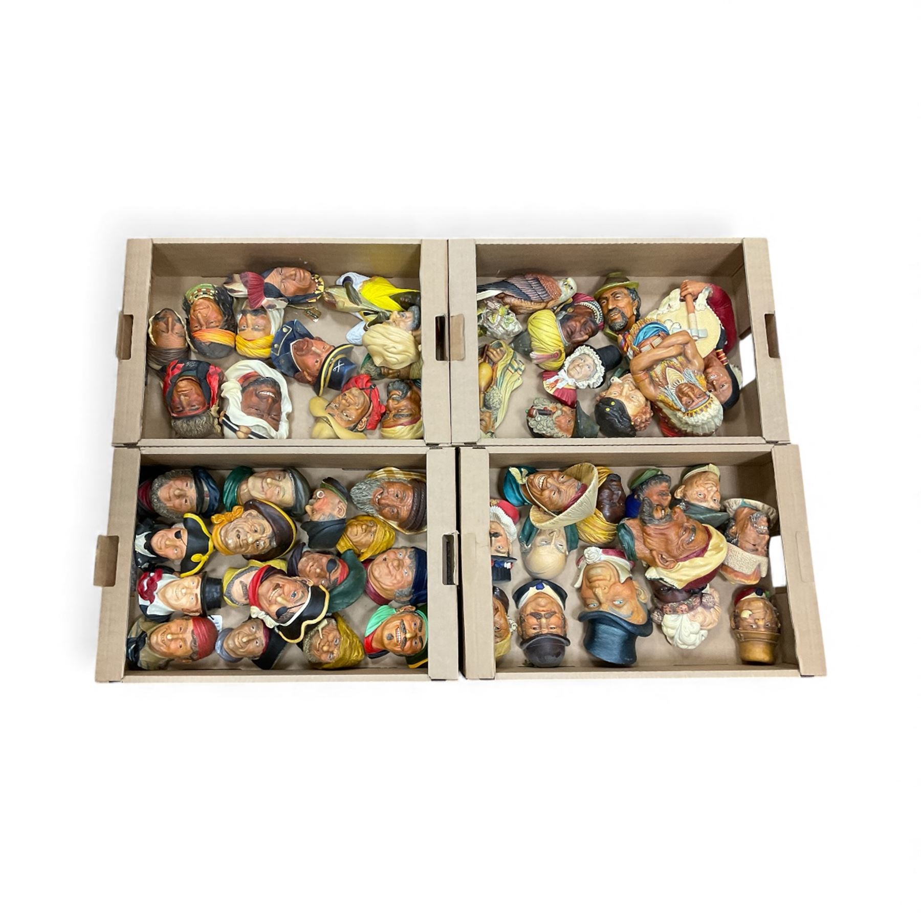 Large collection of Bossons plaster wall-masks, including including fisher man, cowboys, native Americans, etc, in four boxes 