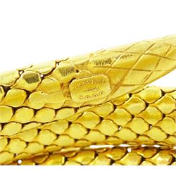 18ct gold coiled diamond snake bangle, the head set with round cut diamonds and emerald eyes, to an expanding articulated body, stamped Brevete S.G.D.G.