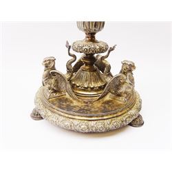 A large Victorian Thomas Bradbury & Sons silver plated candelabrum, the circular base with flower head border upon three domed feet, supporting a central knopped and fluted column flanked by three zoomorphic creatures, leading to a central socket with removable nozzle above a large palmette detailed drip pan, and three scrolling branches with conforming sockets and nozzles, with maker's silver plate mark and Victorian registration lozenge beneath, H62.5cm