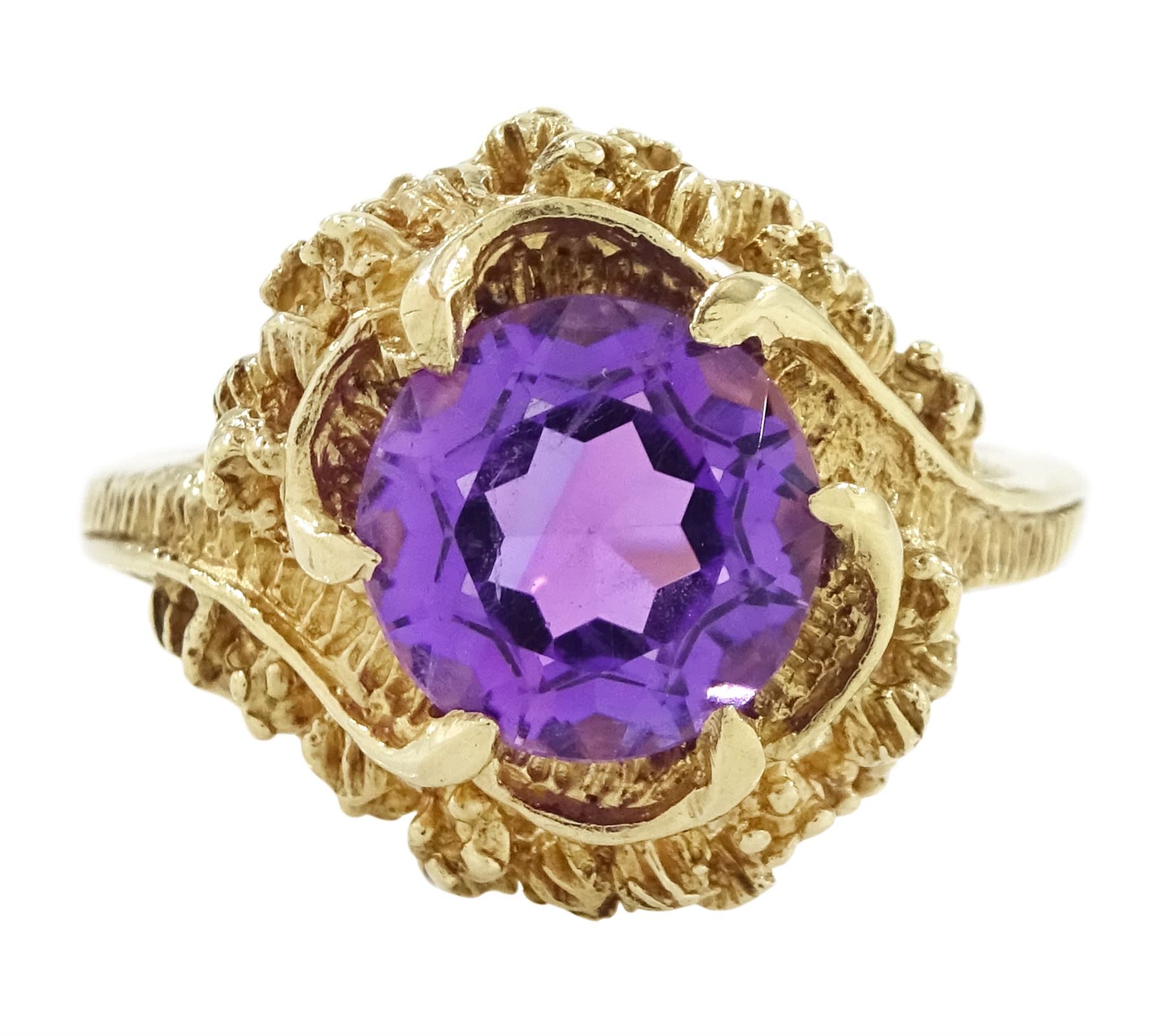9ct gold amethyst single stone ring, round cut amethyst set within a pierced textured surround, London 1972