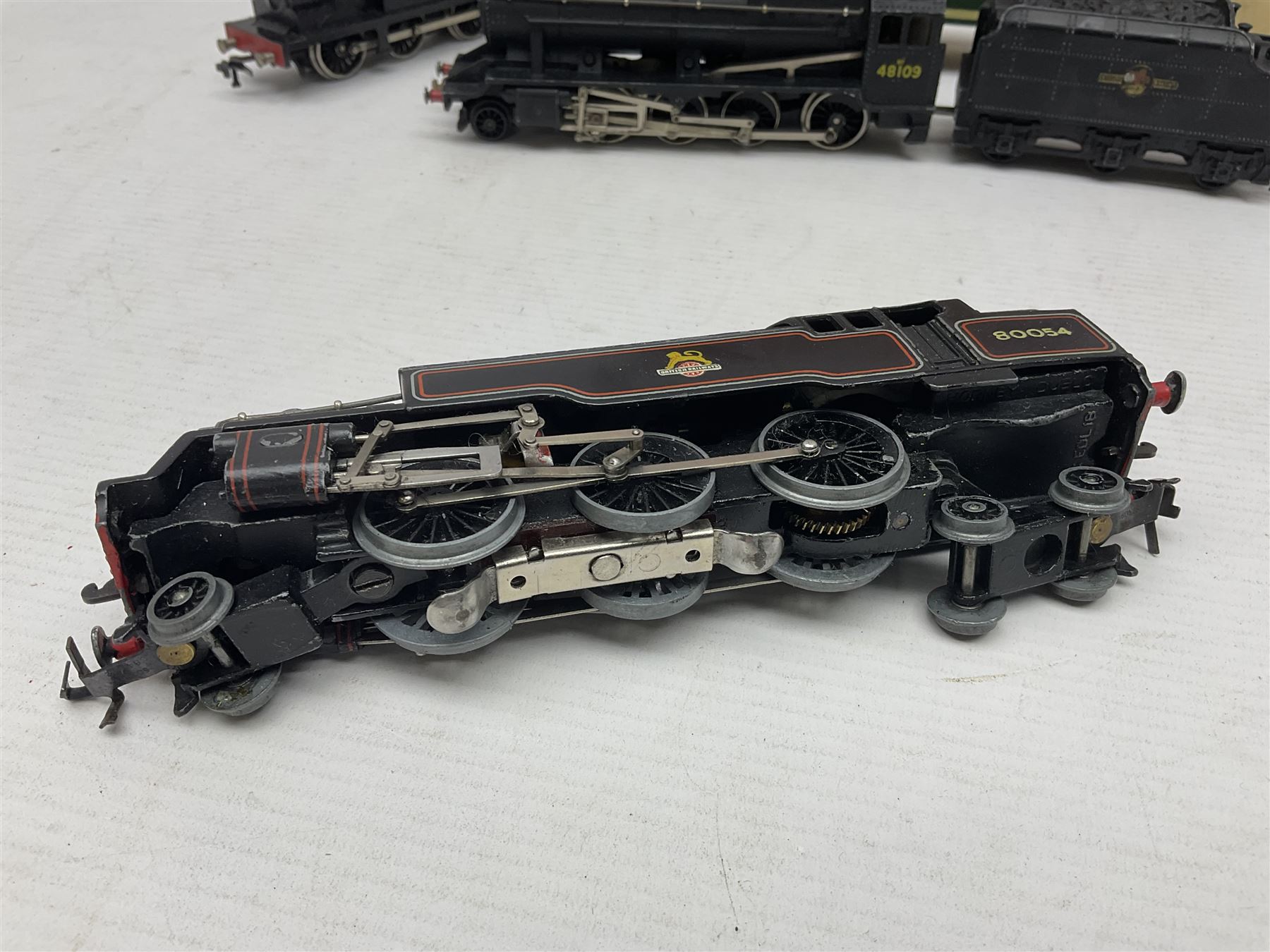Hornby Dublo - 2-rail - Class 8F 2-8-0 locomotive No.48109 in BR black; Class R1 0-6-0 tank locomotive No.31337 in BR black; and Met-Vic Diesel Co-Bo locomotive No.D5702 in BR green; together with 3-rail Class 4MT Standard Tank 2-6-4 locomotive No.80054 in BR black; three unassociated boxes and one unboxed (4)