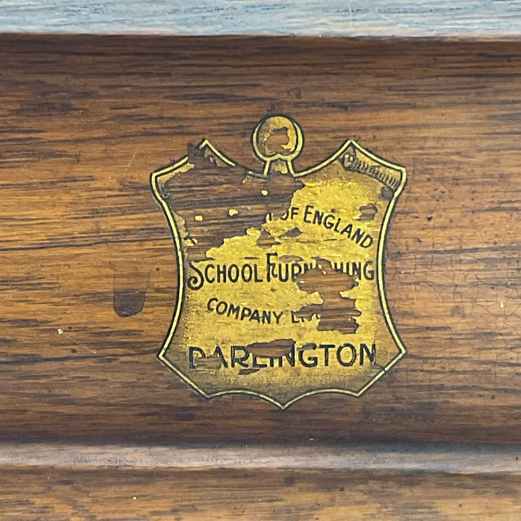 The North of England School Furnishing Company Limited Darlington - early 20th century oak school cupboard, projecting moulded cornice over two panelled doors, fitted with shelves, on chamfered plinth base 