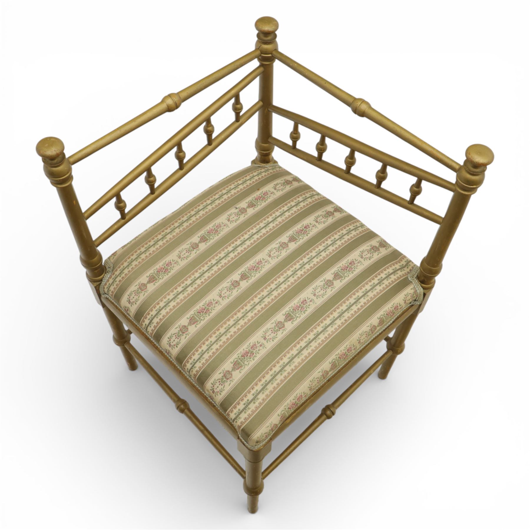 19th century Scandinavian corner chair, with rail back and sides formed with turned spindles and finial terminals, fitted with an upholstered seat in striped floral fabric, raised on turned supports united by stretchers