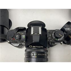 Canon A1 35mm camera body serial no 741264, with 'Tokina AT-X 28-85mm 1:3.5-4.5' lens serial no 821679, 'Canon FD 50mm 1:1.8mm' lens and other camera equipment 
