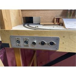 'Z' gauge continental scenic layout with folding legs, various loops of track and sidings with overhead cables, buildings including water tower, tunnels, roads with motor vehicles and figures, trees, haven with boats, backdrop diving wall hiding control units 150 x 50cm