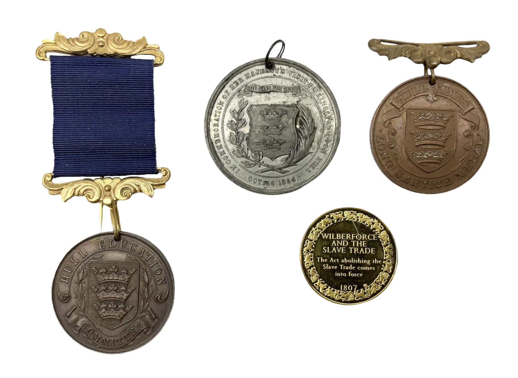 Wilberforce and the Slave Trade silver gilt medallion. First edition No.369; Hull Times bronze Long Service Medal; Hull Education Committee bronze school attendance medal; and a silvered medallion to Commemorate Queen Victoria's Visit to Hull Oct.14 1854; all uncased (4)
