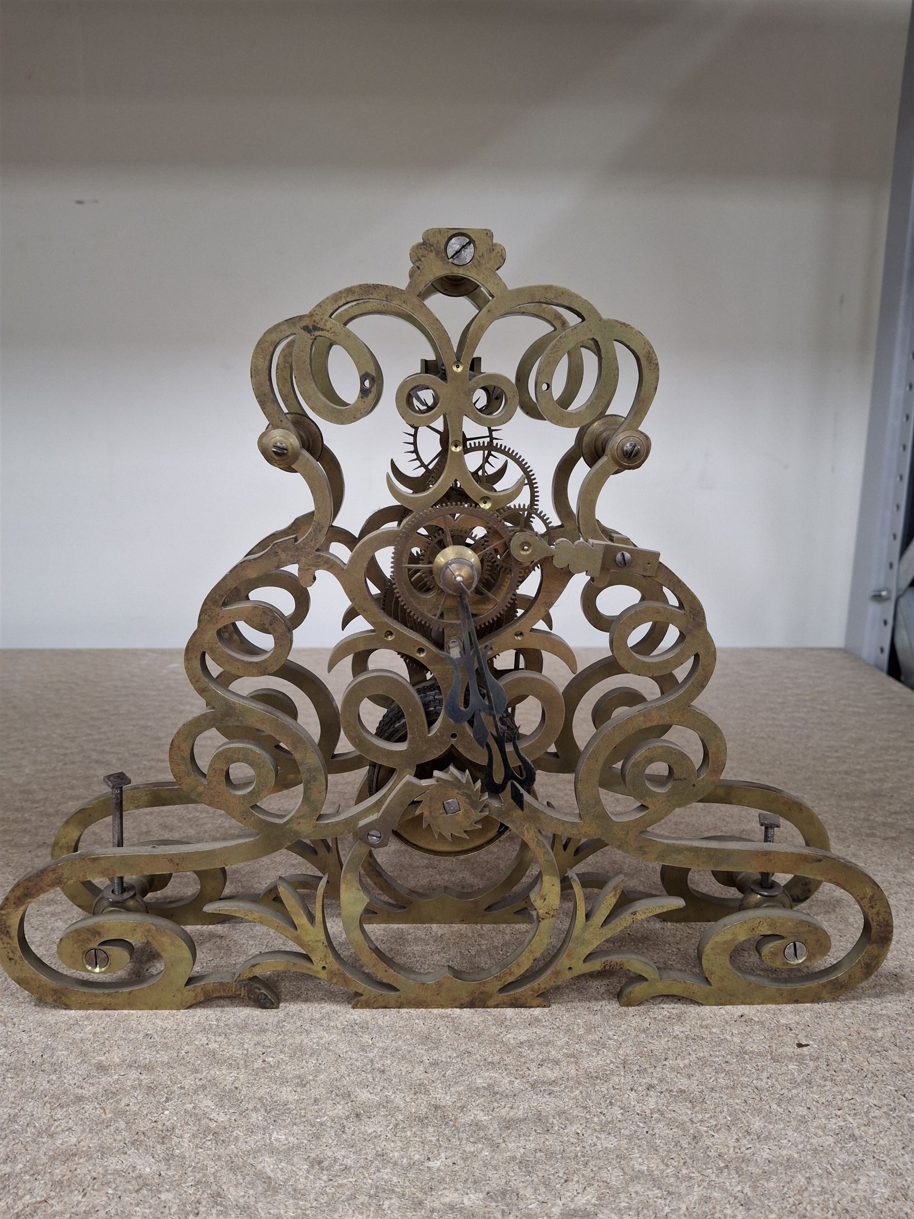 Two skeleton clock movements, tavern clock movement, and further clock movements, all for restoration 