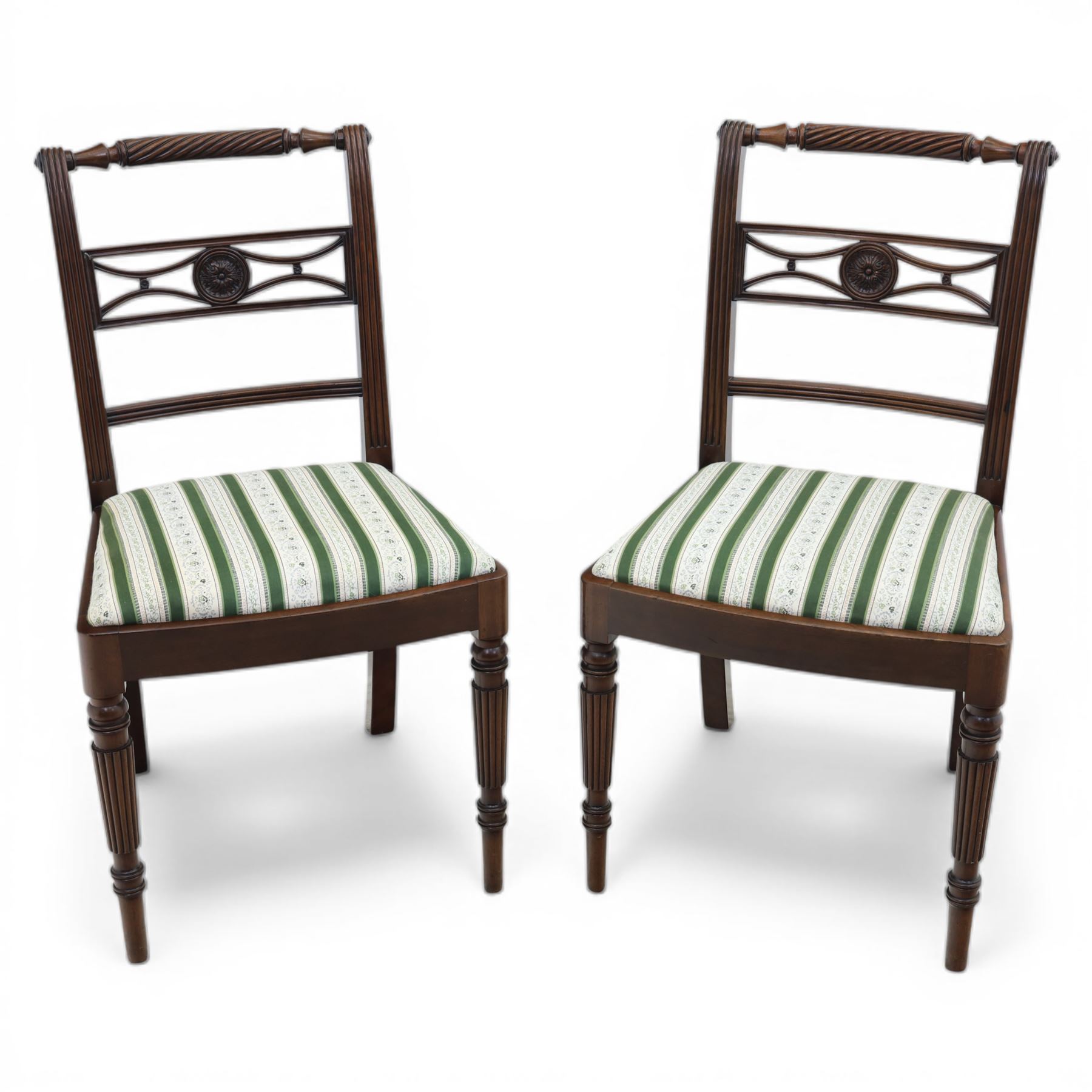 Pair of 19th century mahogany dining chairs, the wrythen top rail above a pierced splat and reeded side supports, above a white and green upholstered drop in seat, upon turned and reeded front and plain back legs