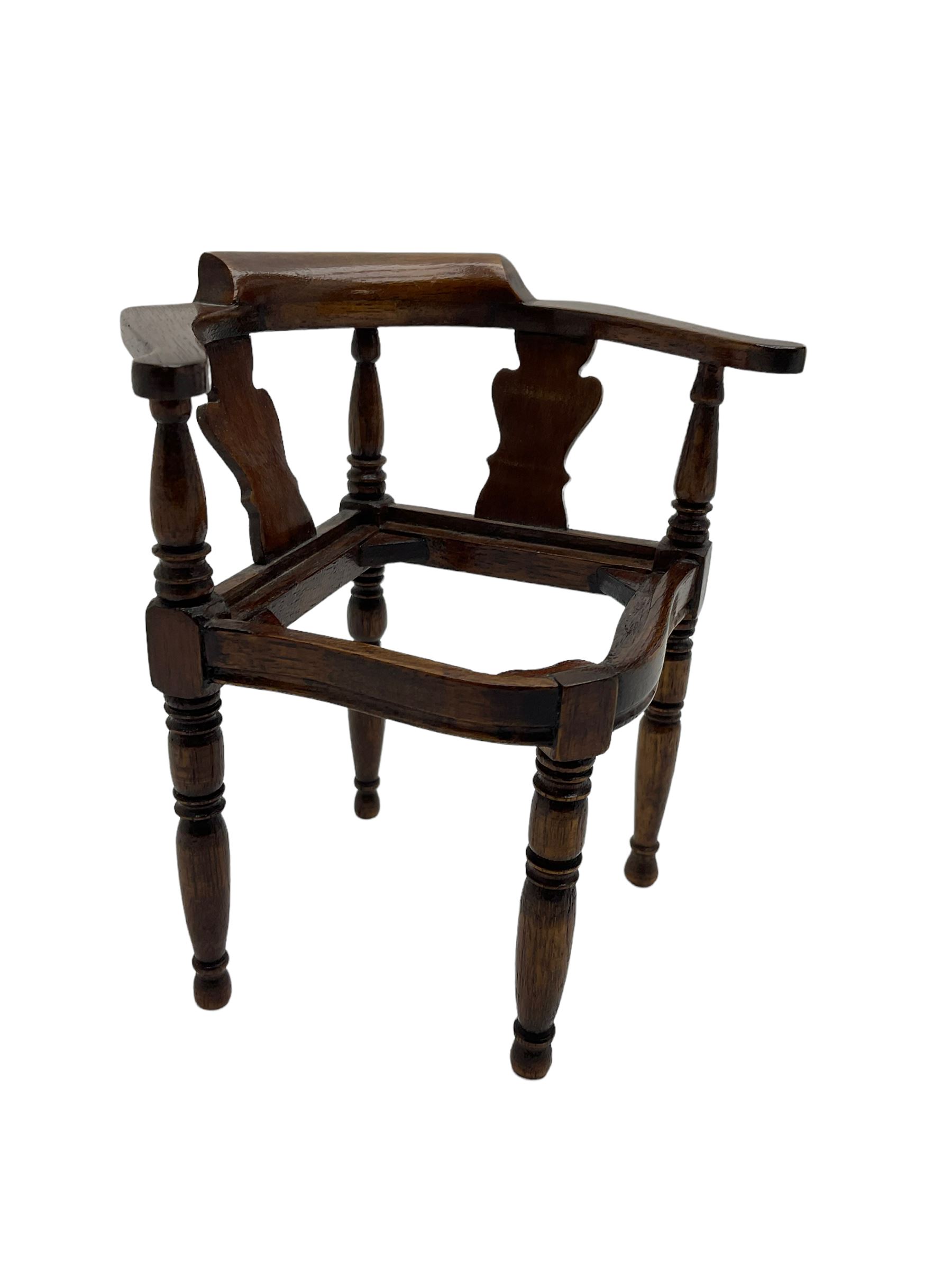 Captain Scott replica mahogany cabin chair, corner shaped with studded leather seat, with miniature prototype and paperwork