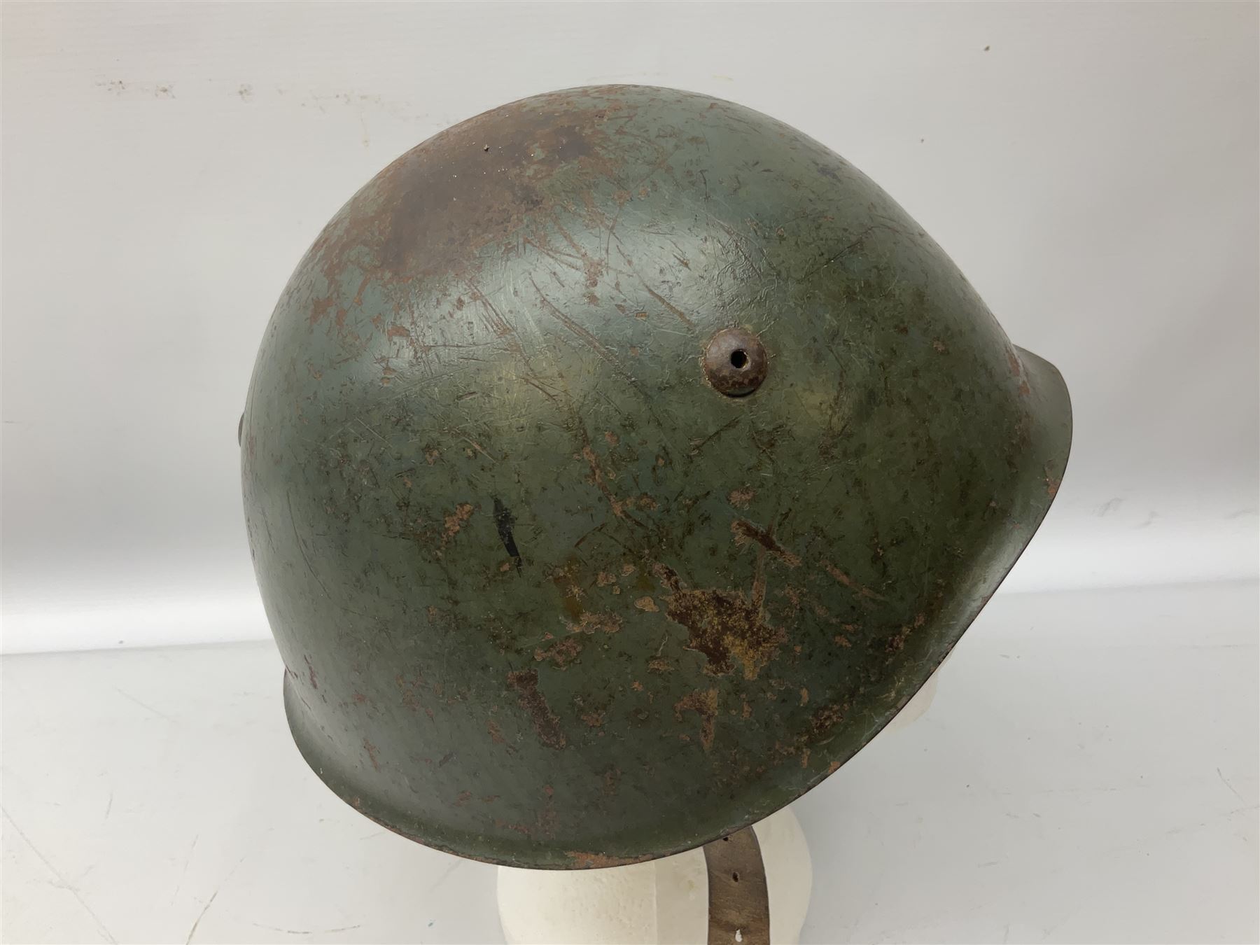 WWII Italian steel helmet with liner and chin strap