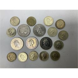 Five Queen Elizabeth II five pound coins and thirteen old style two pound coin