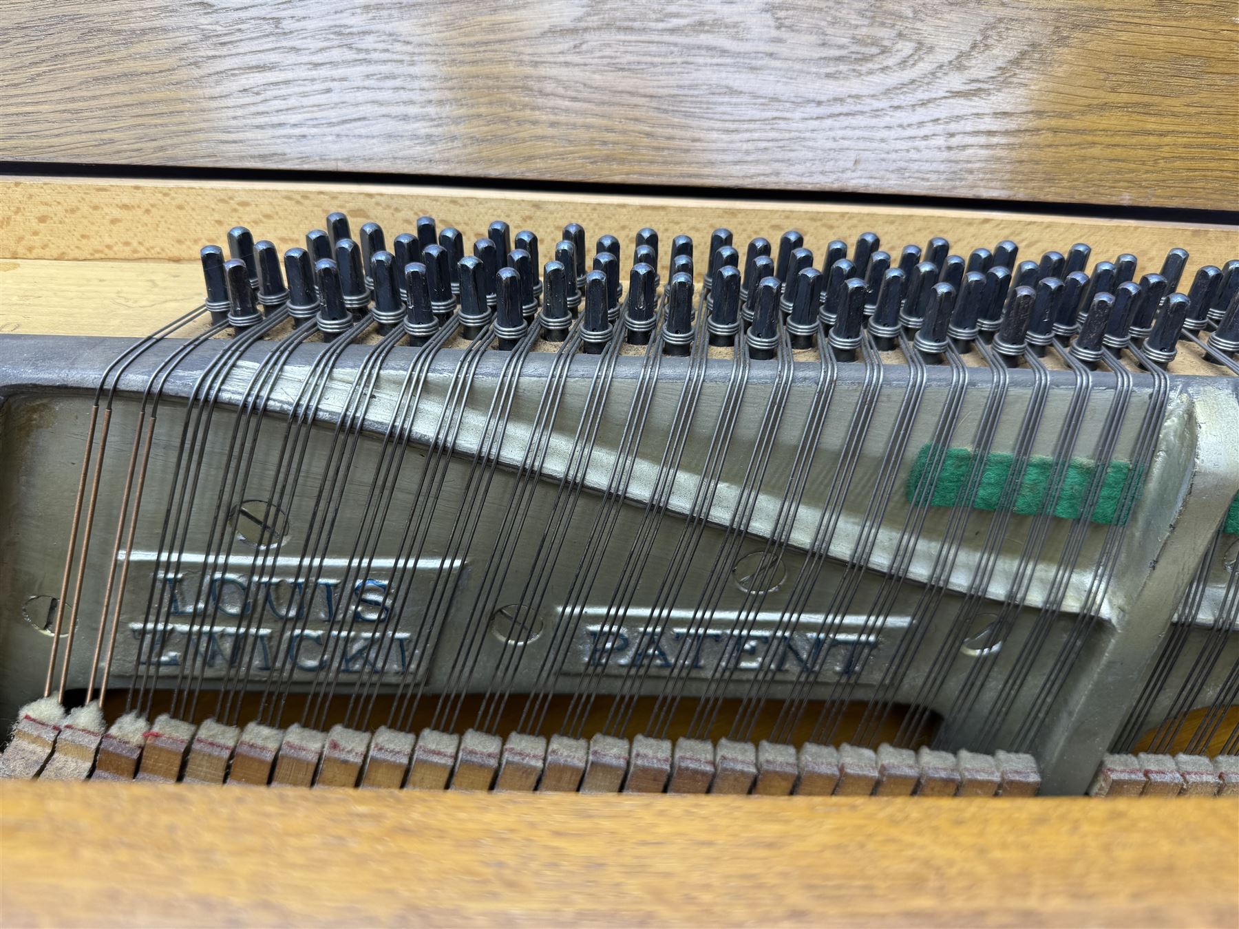 Louis Zwicki - mid-20th century oak cased compact piano, fitted with a folding music rest and full keyboard, dual brass pedals