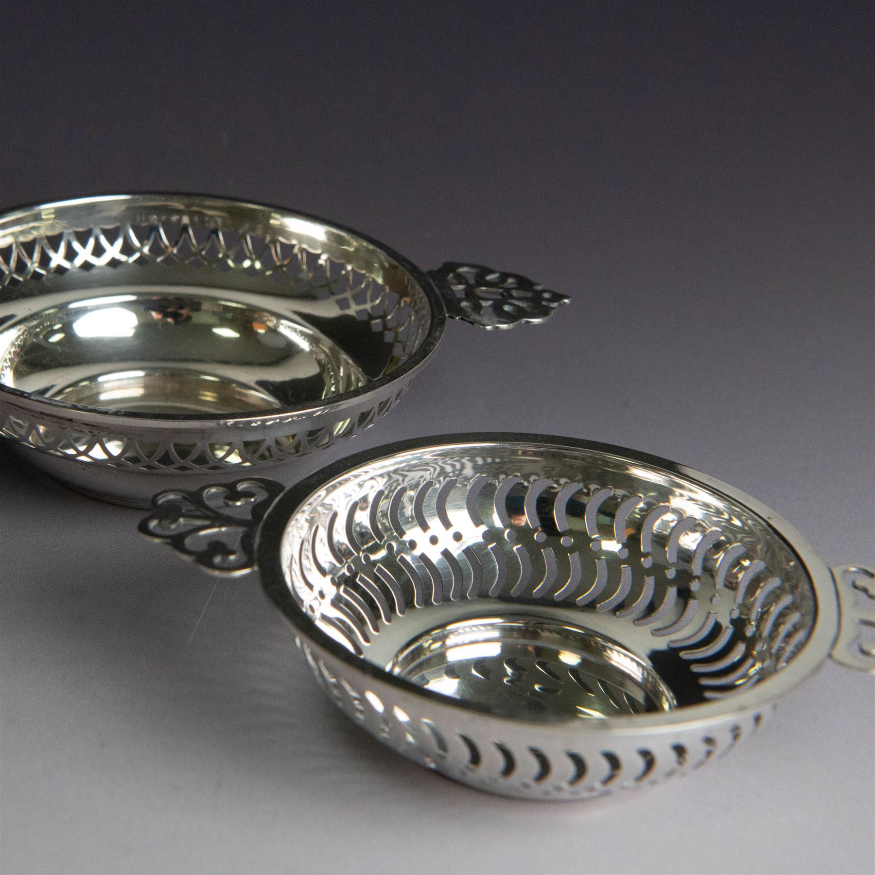 Two pairs of Victorian silver bon bon dishes, modelled as quaiches with pierced sides and twin handles, the larger pair hallmarked Synyer & Beddoes, Birmingham 1913 or 1938, the smaller pair hallmarked Birmingham 1913 or 1938, maker's marks worn and indistinct, largest D9cm