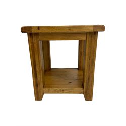 Pair of oak lamp or bedside tables, square top raised on square supports, united by undertier