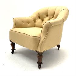 Victorian rosewood tub shaped armchair, upholstered in pale gold buttoned fabric, turned front supports with castors