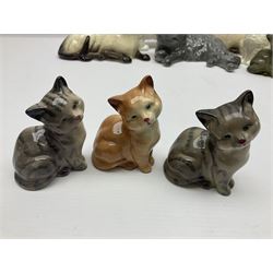 Ten ceramic cat figures, to include pair of Royal Doulton Siamese cats, four other Royal Doulton examples and four Beswick examples 