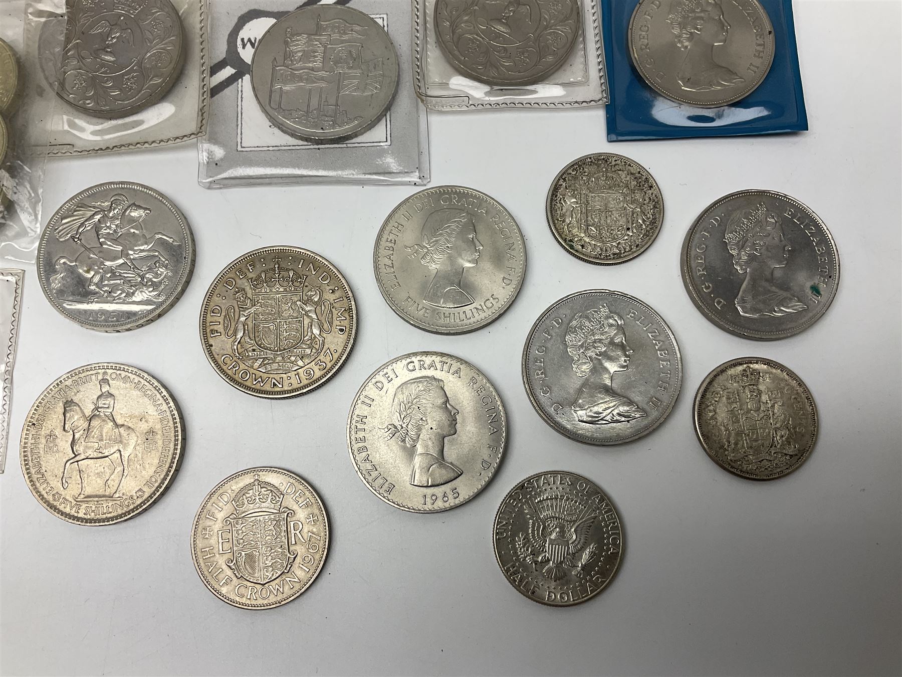 King George VI 1937 crown coin, various commemorative crowns, Queen Elizabeth II Canada 1957 and 1959 fifty cent coins, four Great British five pound coins, United States of America 1964 half dollar etc