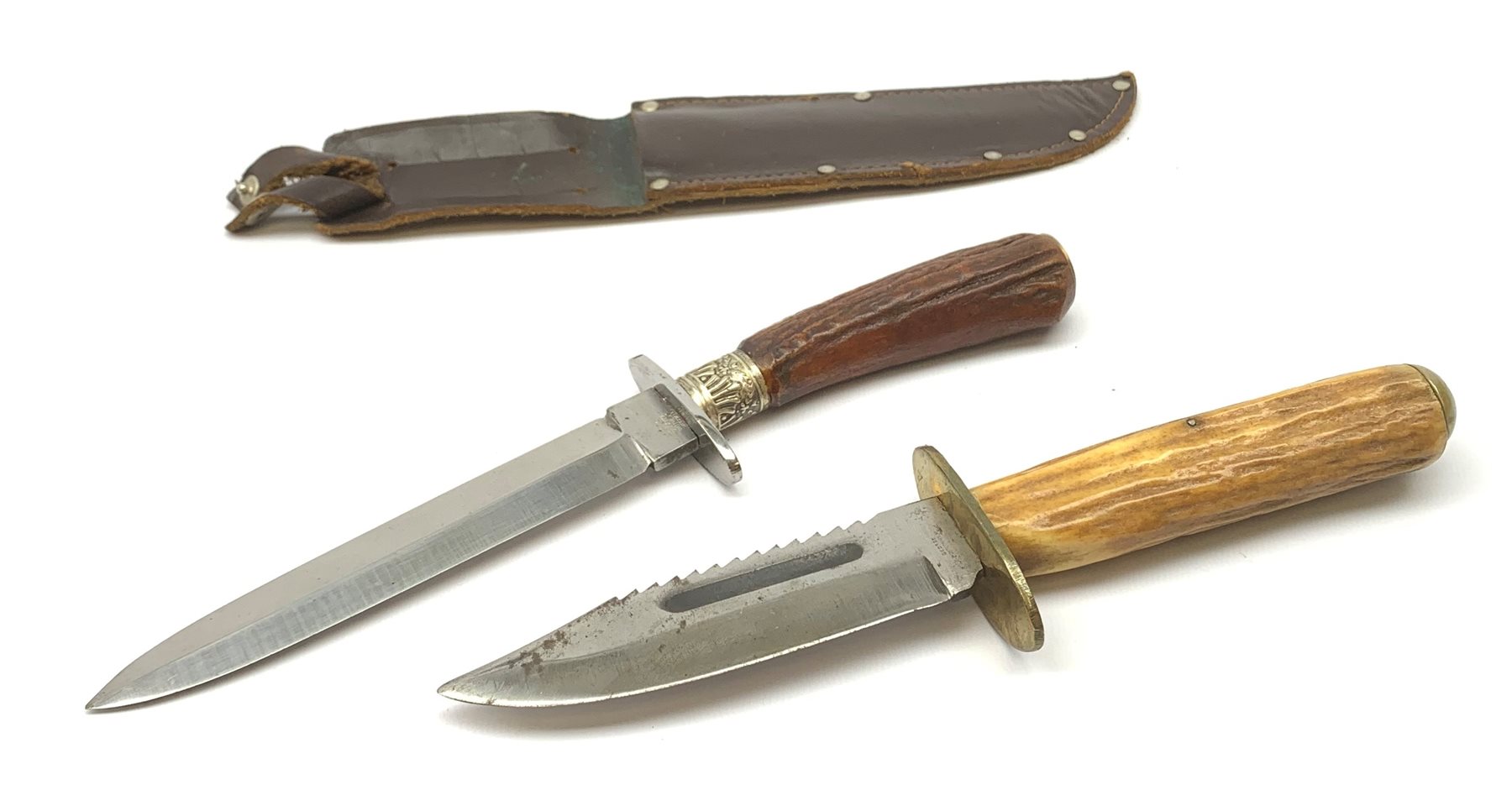 Bowie knife, the 12cm steel single edged sawback blade marked to the