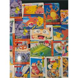 Collection of Pokemon TGC trading cards, including two WB First Movie Black Star promo cards Pikachu no. 4 and Dragonite no. 5, two Ancient Mew Black Star holo promo cards, Gym Challenge Giovanni's Persian 8/132 holo and a small collection WOTC, Neo Discovery and Neo Genesis cards, together with thirty four Bandai Carddass Pokemon cards, including prism Charizard no. 186 and Pokemon Topps cards including holo examples 