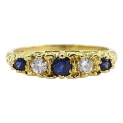 18ct gold five stone sapphire and diamond ring, with scroll detail to shoulders and gallery, London 1989
