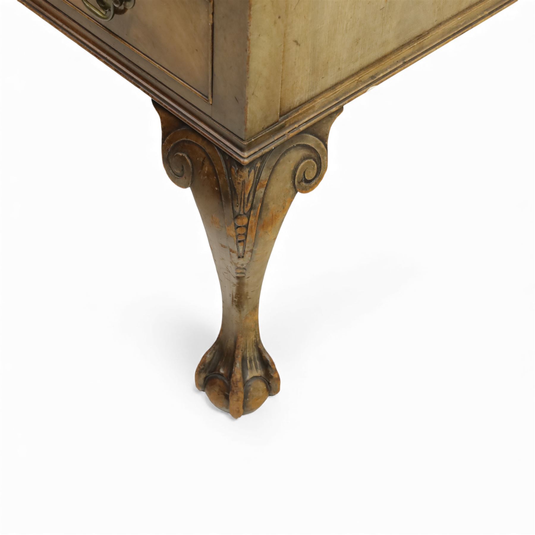 Waring & Gillow - Early 20th century mahogany desk, the leather-inset top above a shaped kneehole, central compartmented frieze drawer flanked by twin banks of of three drawers, each with brass handles, raised on cabriole legs with carved ball and claw feet (Height from floor to underside 62cm)