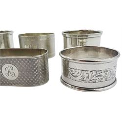 Six silver napkin rings of various form and decoration, comprising pair of early 20th century examples with engraved monograms, hallmarked Birmingham 1916, makers mark worn and indistinct, modern example hallmarked Elkington & Co Ltd, Birmingham 1959, and three others, various makers, hallmarked Chester and Birmingham, dates ranging 1920 to 1939, approximate total weight 4.08 ozt (127 grams)