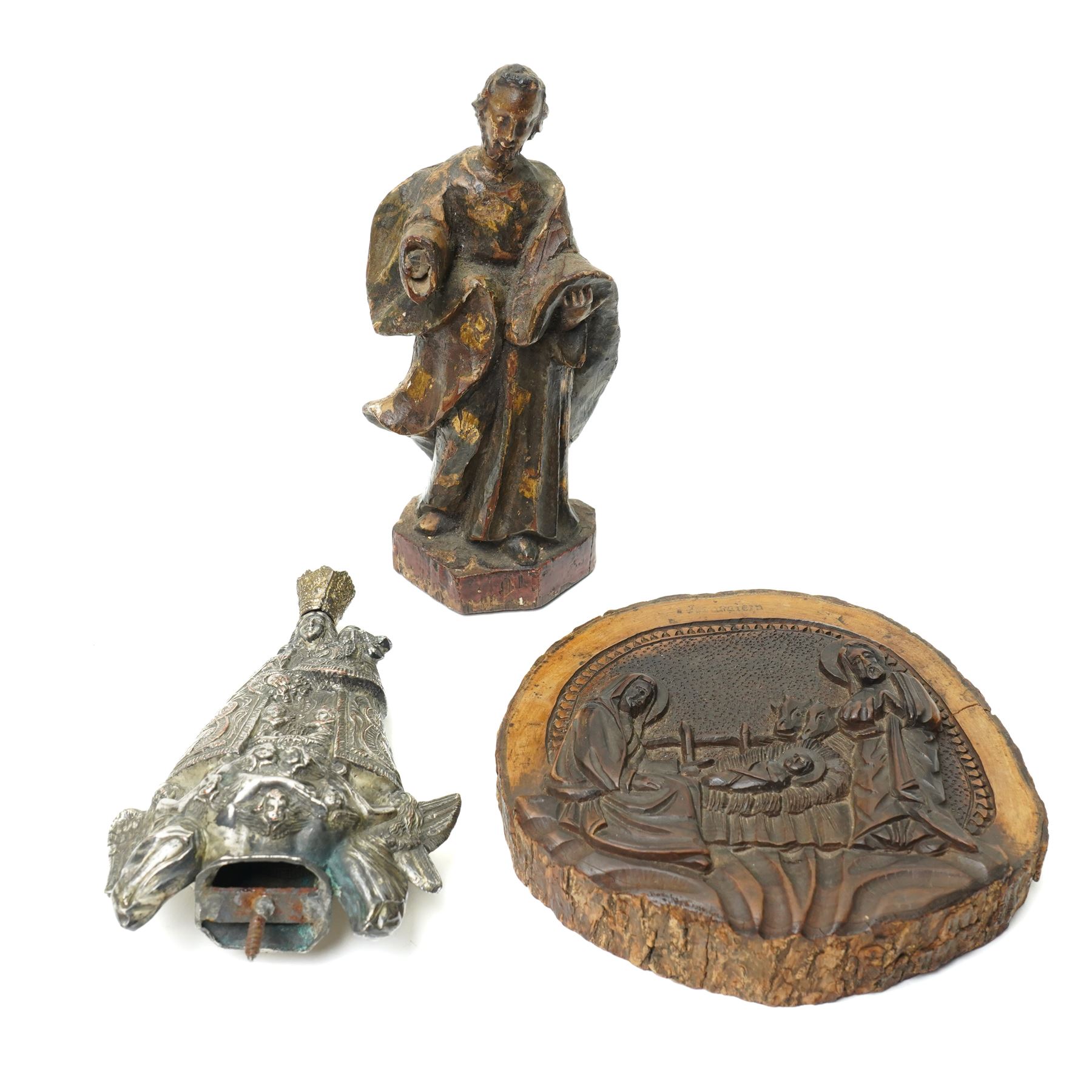 Italian olive wood plaque carved with a manger scene D13cm, continental silver plated processional finial formed as BVM and child and an Italian carved polychrome figure of a saint H15cm (3)