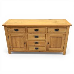 Modern light oak sideboard, fitted with six drawers and two cupboards